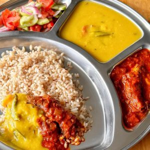 Buthai pulimunchi sardine curry served with rice, dal and salad