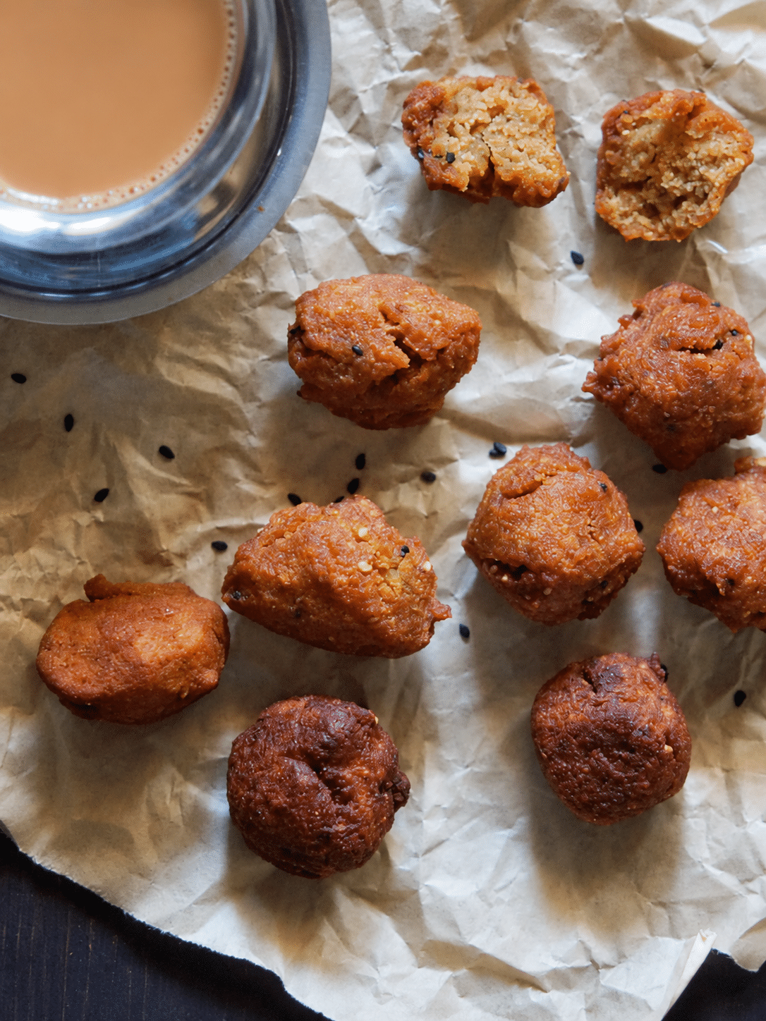 Golden and darker Garige fritters draining on kitchen paper