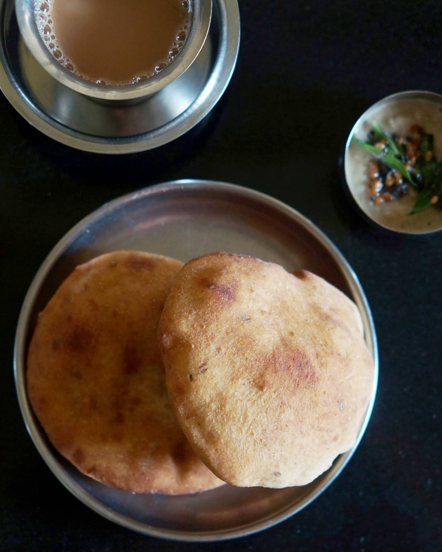 Golden Mangalore buns served with chutney and a cup of chai