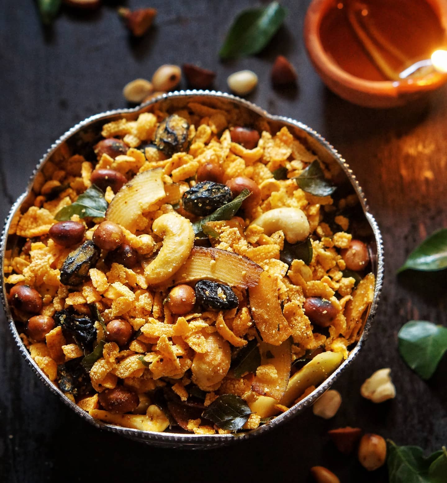 Poha chivda with peanuts, cashews, raisins, coconut and curry leaves