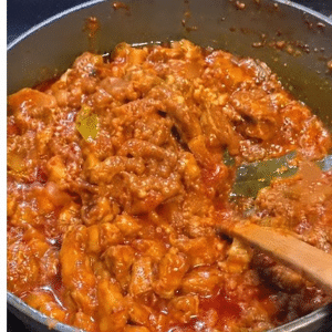 Pork Indad with its rich red masala in a cooking pan